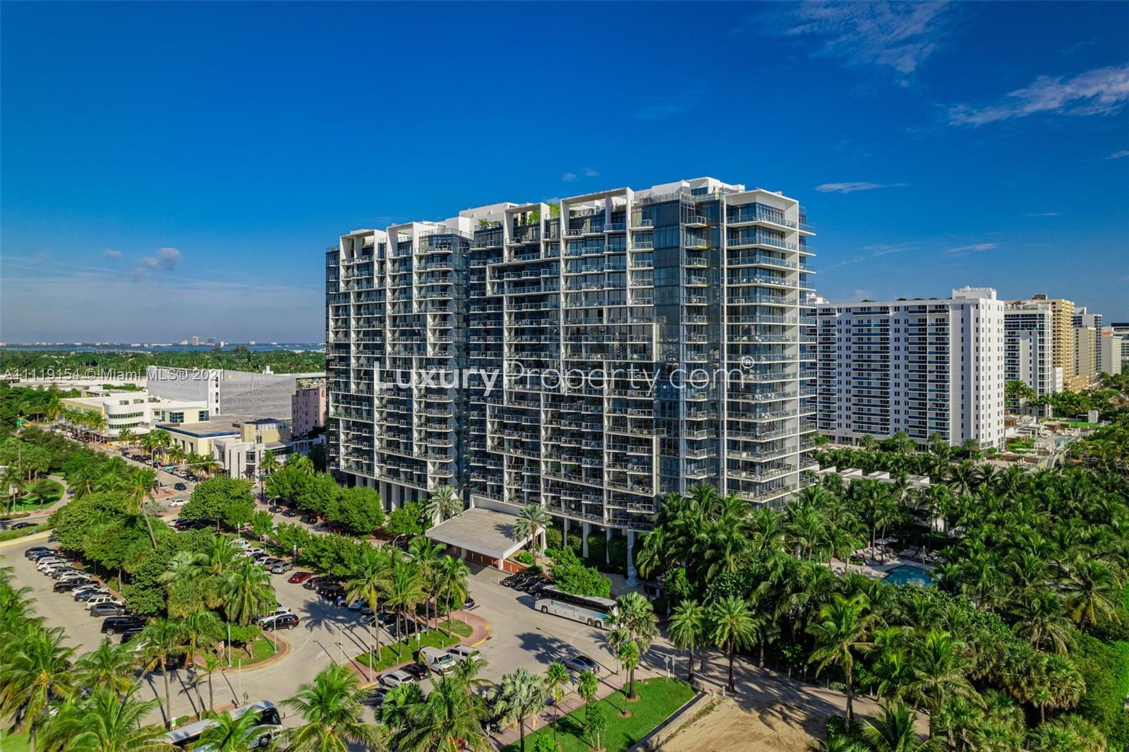 Aerial view of luxury Miami oceanfront villa with pool and beach access