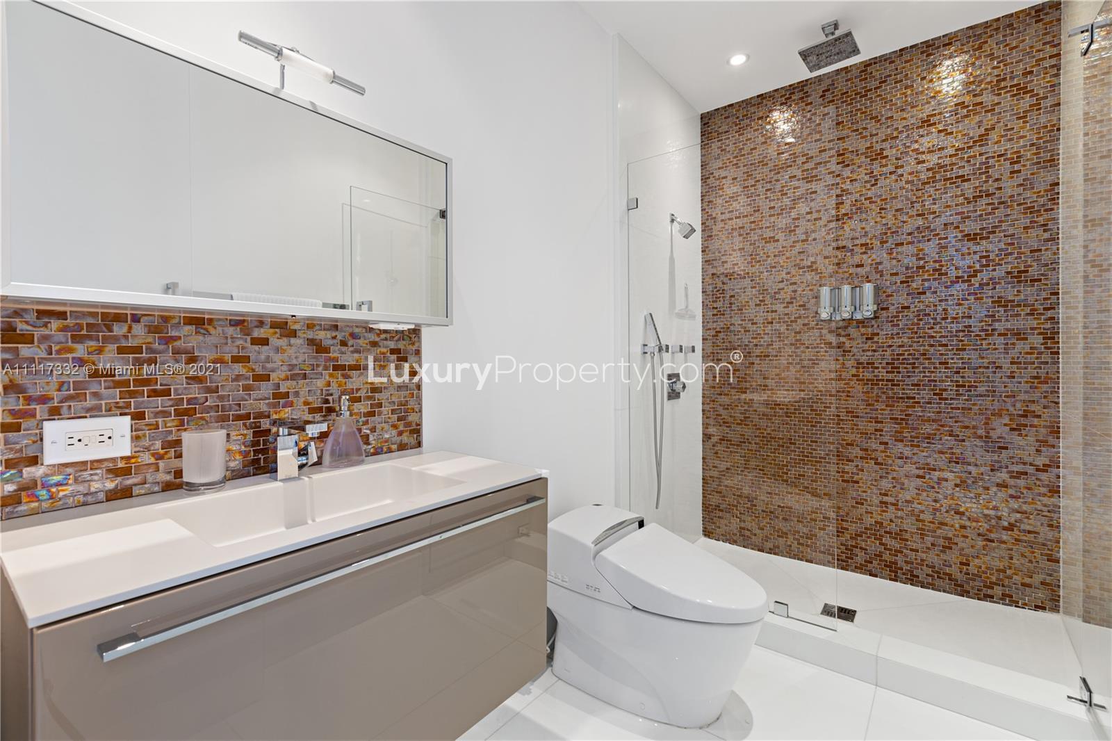 Oceanview beach villa in Miami with spacious balconies and lush landscaping at Collins Ave