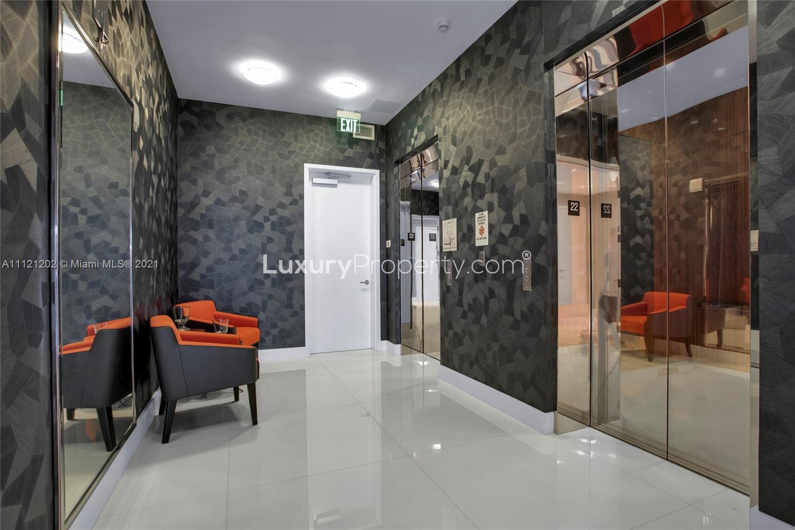 Luxurious living room in 4-bed villa for sale, Miami, with ocean view and modern decor