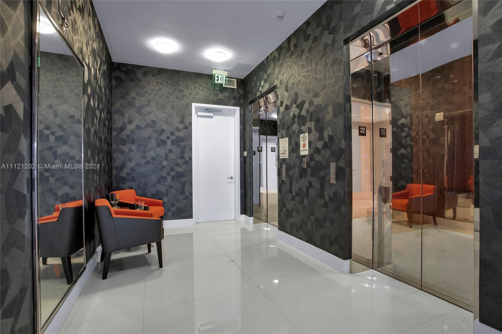 Luxurious living room in 4-bed villa for sale, Miami, with ocean view and modern decor