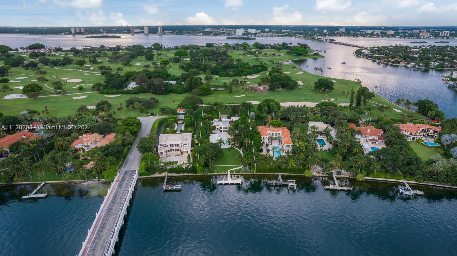 Modern villa exterior at 37 Indian Creek Island Rd, surrounded by lush greenery
