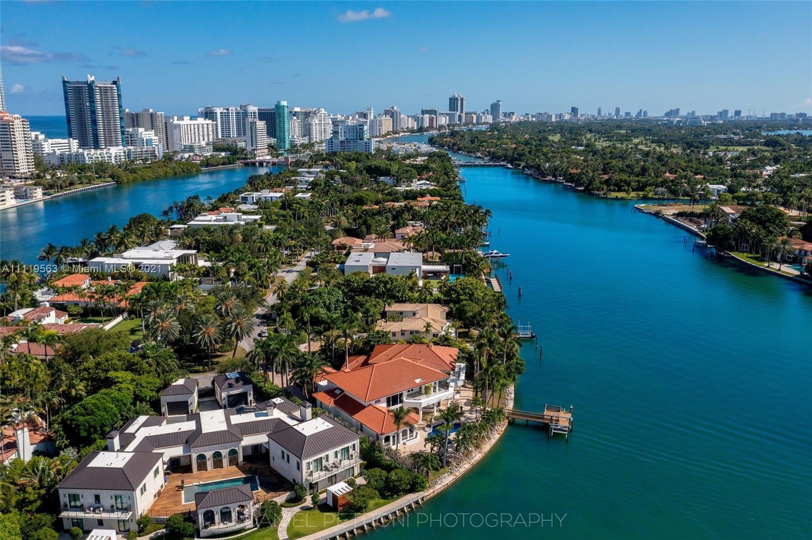 Dock view of luxury villa for sale in Miami, Florida, at 6640 Allison Rd