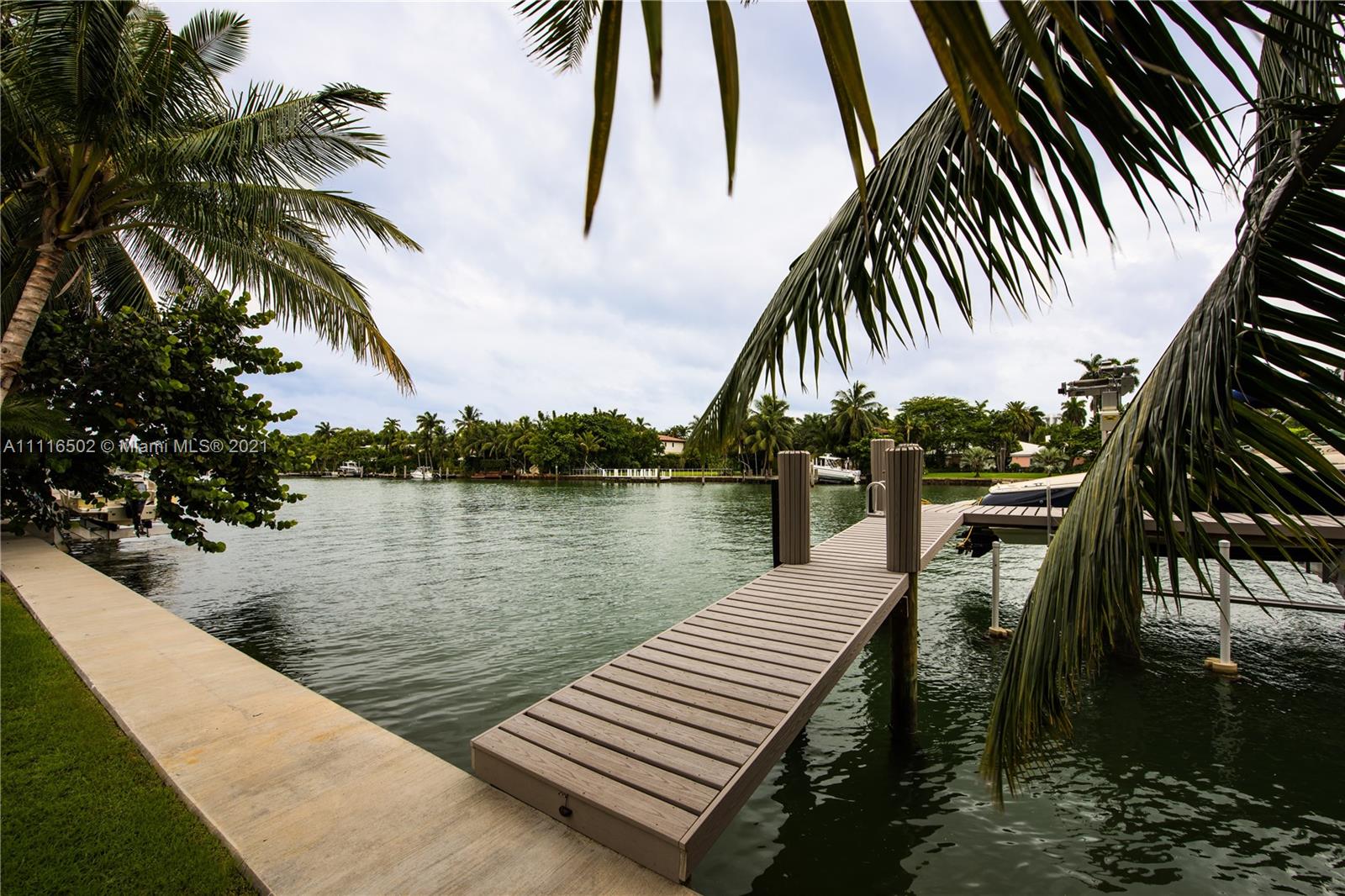 Renovated waterfront villa with pool and dock at 2767 Sunset Dr, Miami, Florida for sale