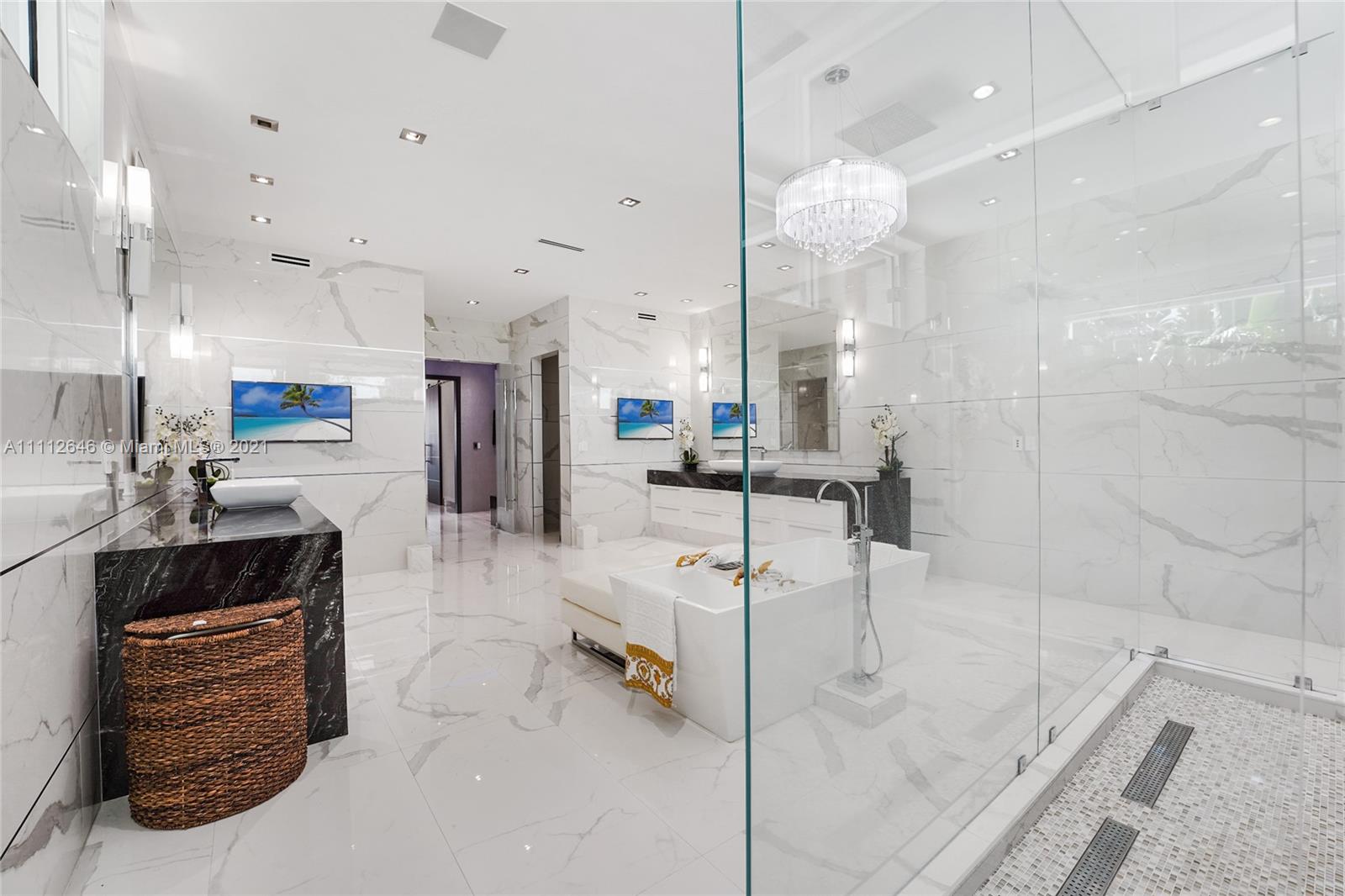 Luxurious waterfront villa with modern architecture, palm trees, and sunset view in Fort Lauderdale