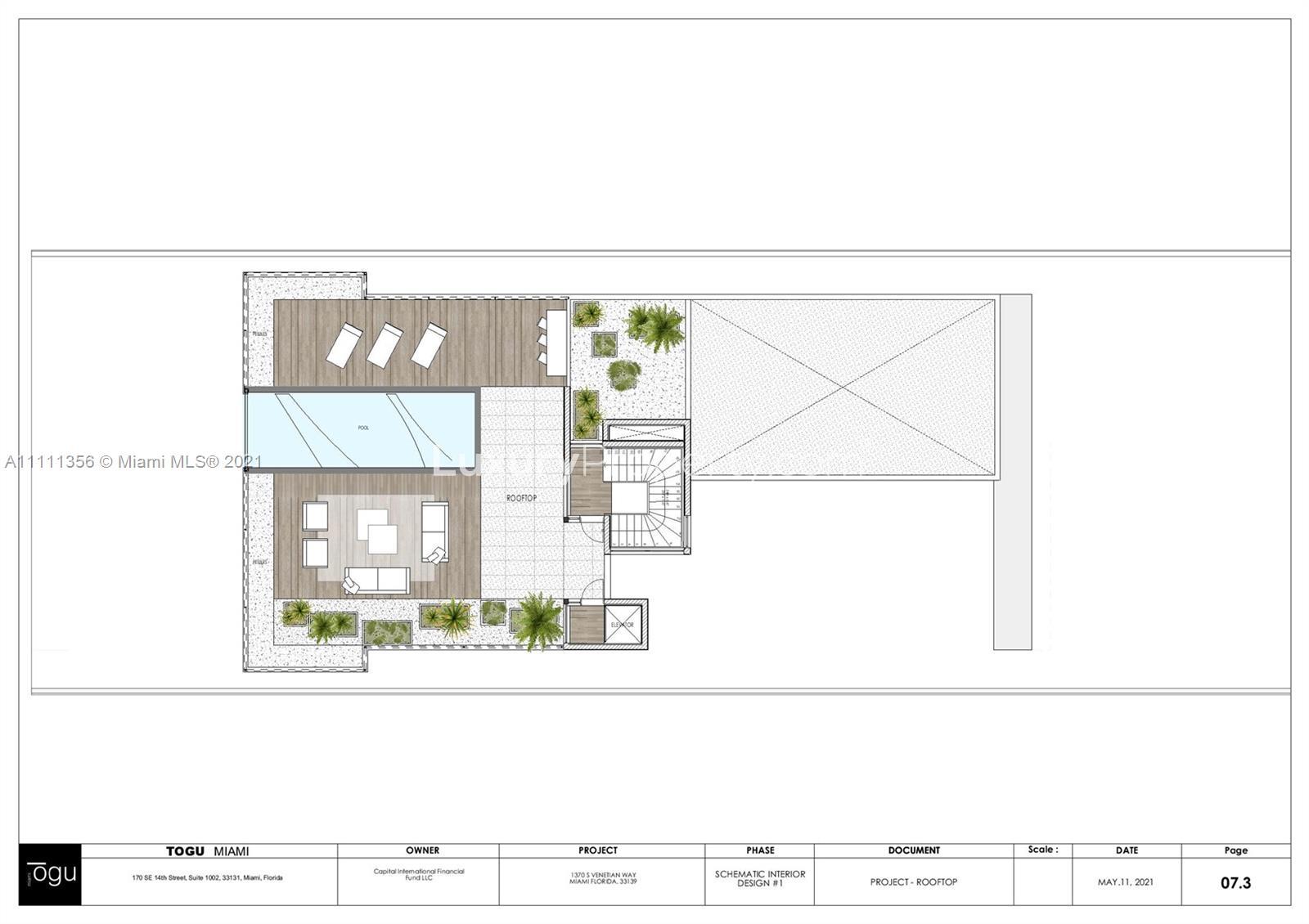 Furnished waterfront villa exterior with lush greenery at 1370 S Venetian Way, Miami