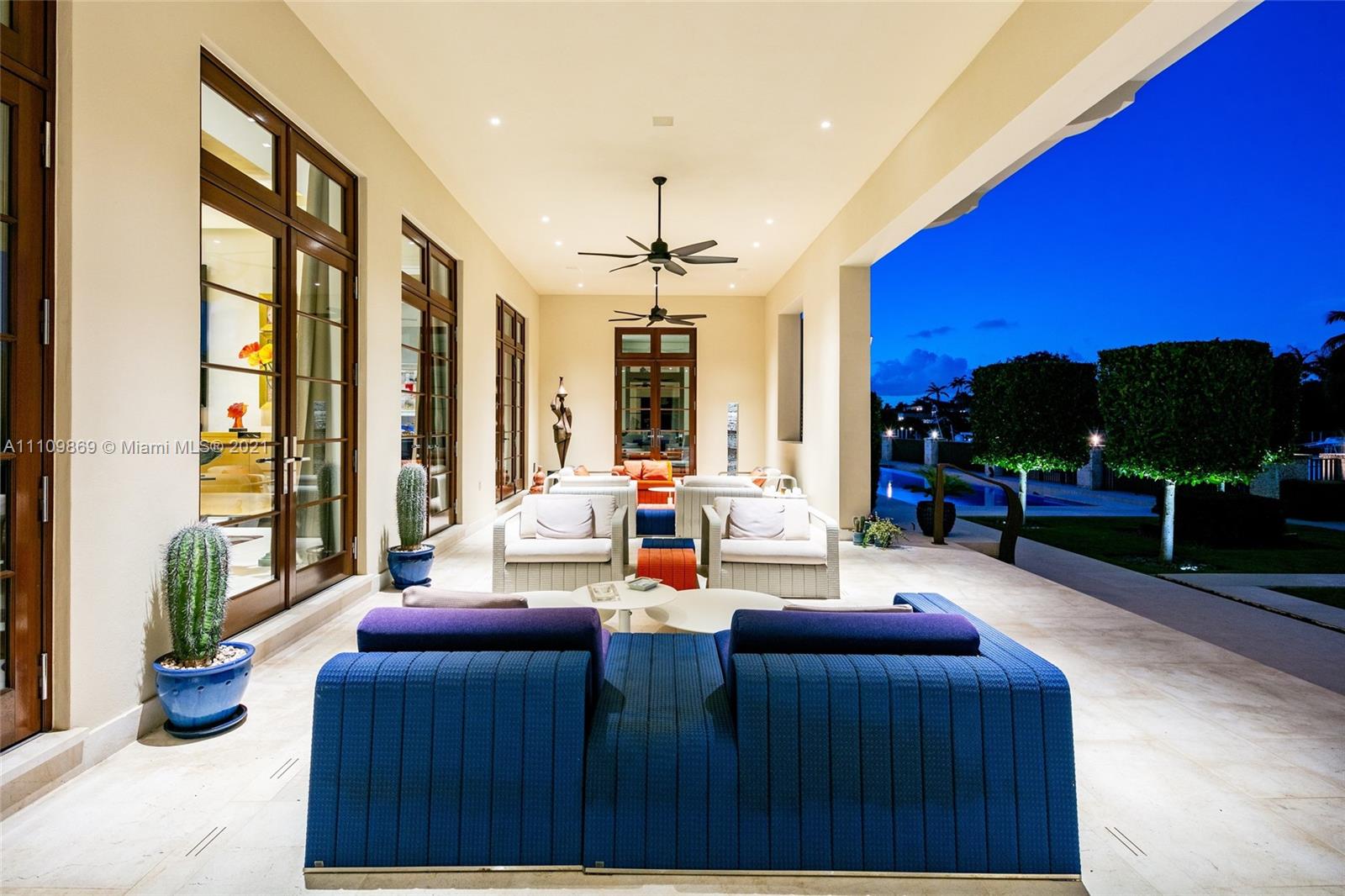 Luxurious villa poolside at sunset, Coral Gables home, 6901 Granada Blvd, Miami