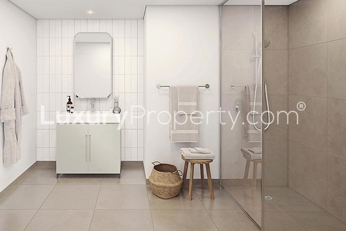 Modern bathroom in one-bedroom apartment at Eaton Place, Jumeirah Village Circle, Dubai