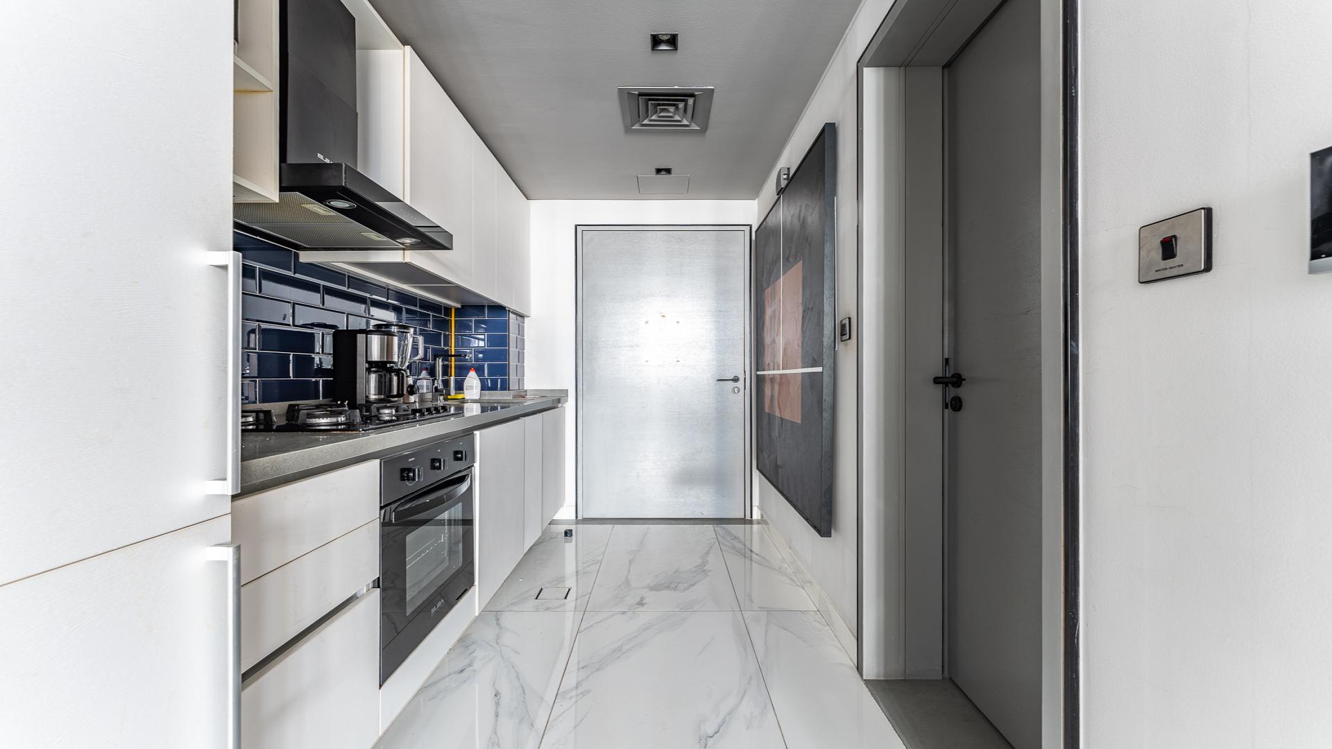 Furnished studio apartment interior in MAG 318, Business Bay with modern decor and city view