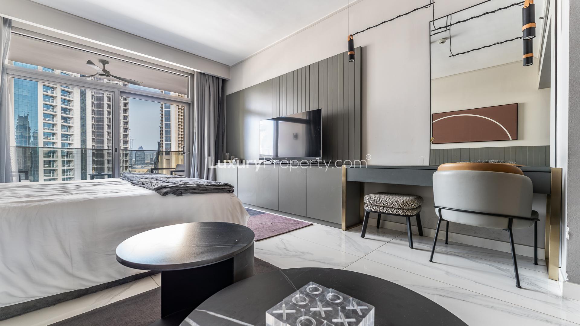 Furnished studio apartment interior at MAG 318, Business Bay, featuring modern decor and cozy ambiance