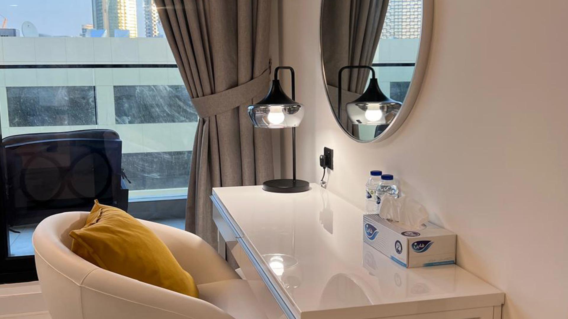 Fully furnished studio apartment interior at LOCI Residences, Jumeirah Village Circle