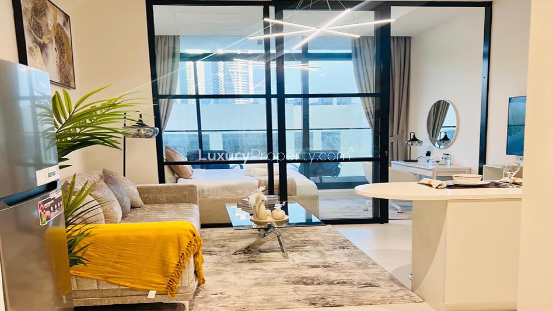 Modern studio kitchen in LOCI Residences, Jumeirah Village Circle, featuring sleek design and amenities