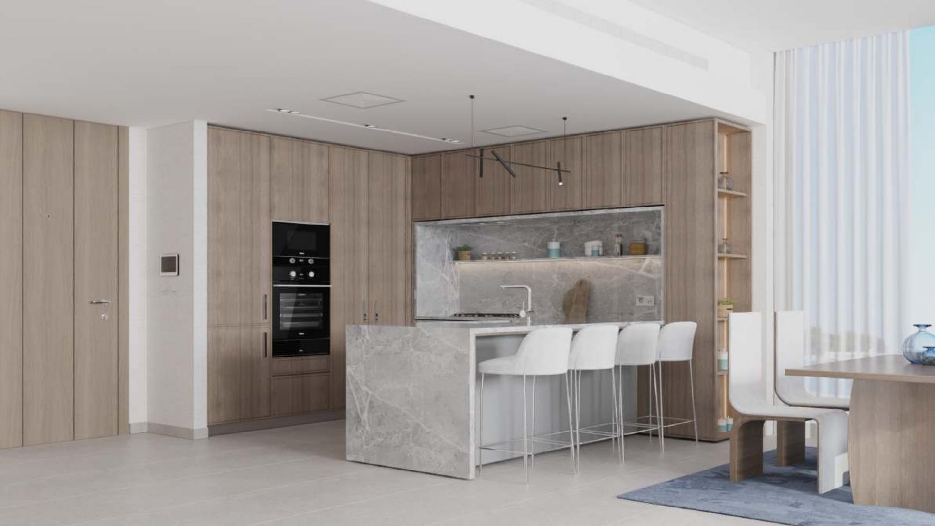 "Ellington Art Bay Studio Apartments, waterfront luxury in Al Jaddaf, modern architecture, for sale.",Modern kitchen in Art Bay Studio Apartments, Al Jaddaf, featuring sleek design and luxury finishes