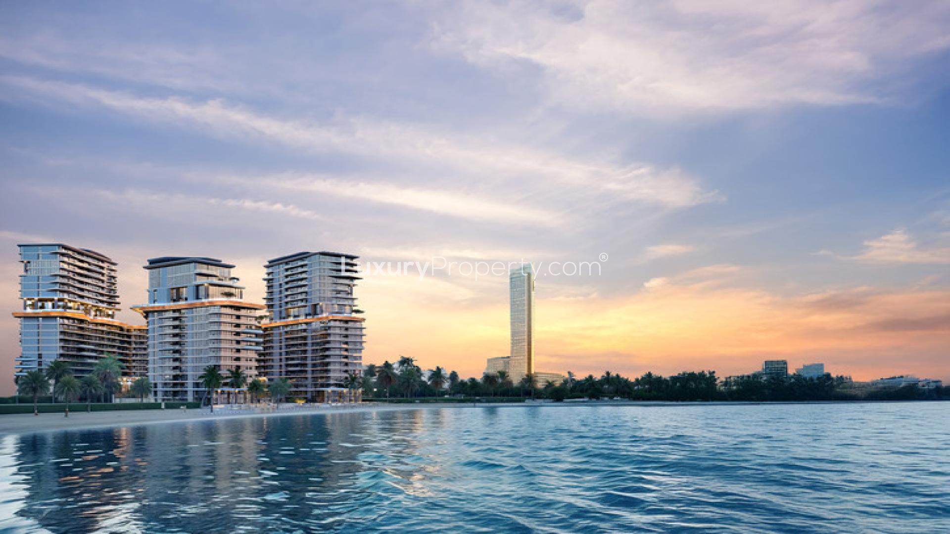 Sophisticated studio apartment exterior in Costa Mare, Al Marjan Island, beachfront view at sunset