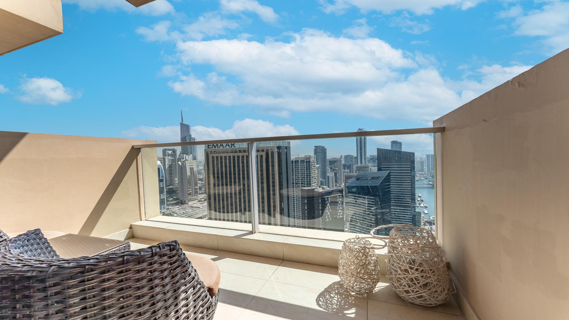 Fully furnished studio apartment bedroom in JW Marriott, Dubai Marina, with modern decor