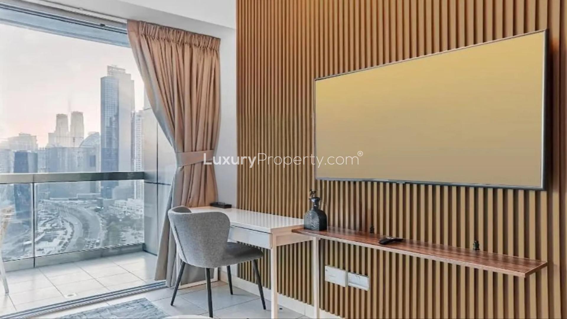 Furnished studio apartment interior at 8 Boulevard Walk, Downtown Dubai, with modern decor