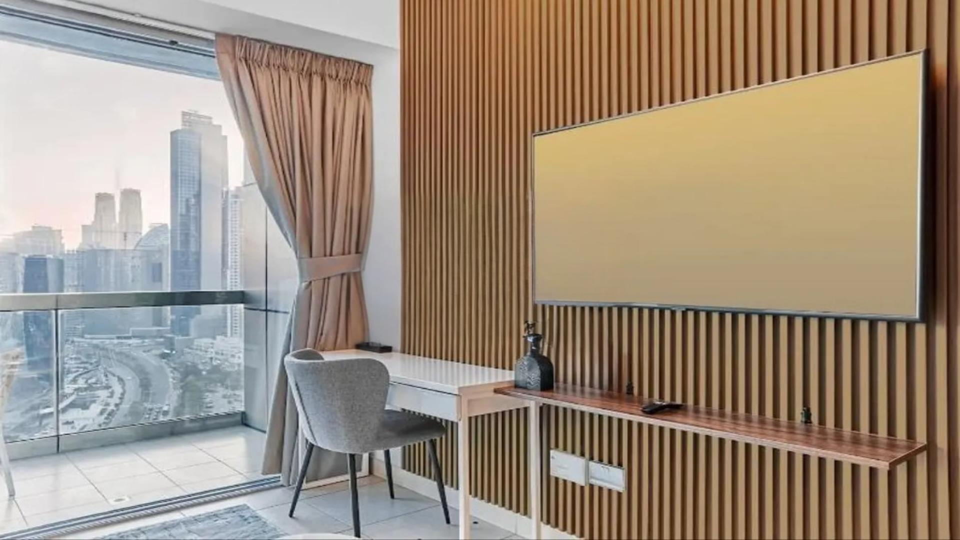 Furnished studio apartment interior at 8 Boulevard Walk, Downtown Dubai, with modern decor