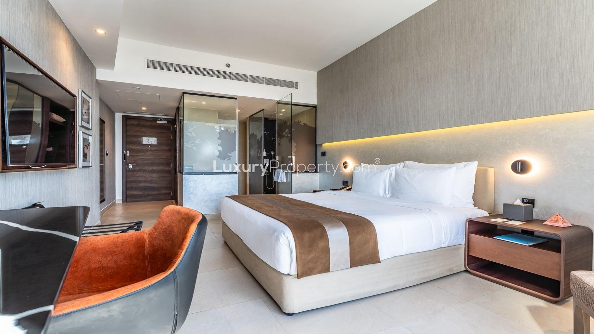 Fully furnished studio apartment interior at The One, Jumeirah Village Triangle
