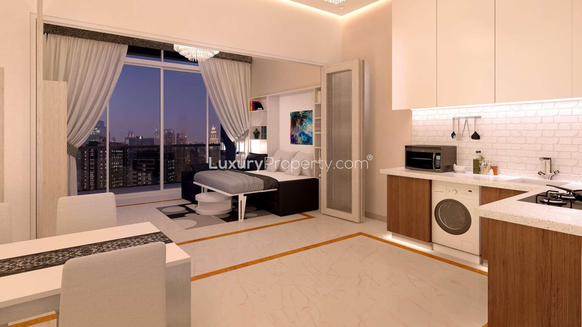 Balcony view from Bayz Tower studio overlooking Business Bay skyline and waterfront