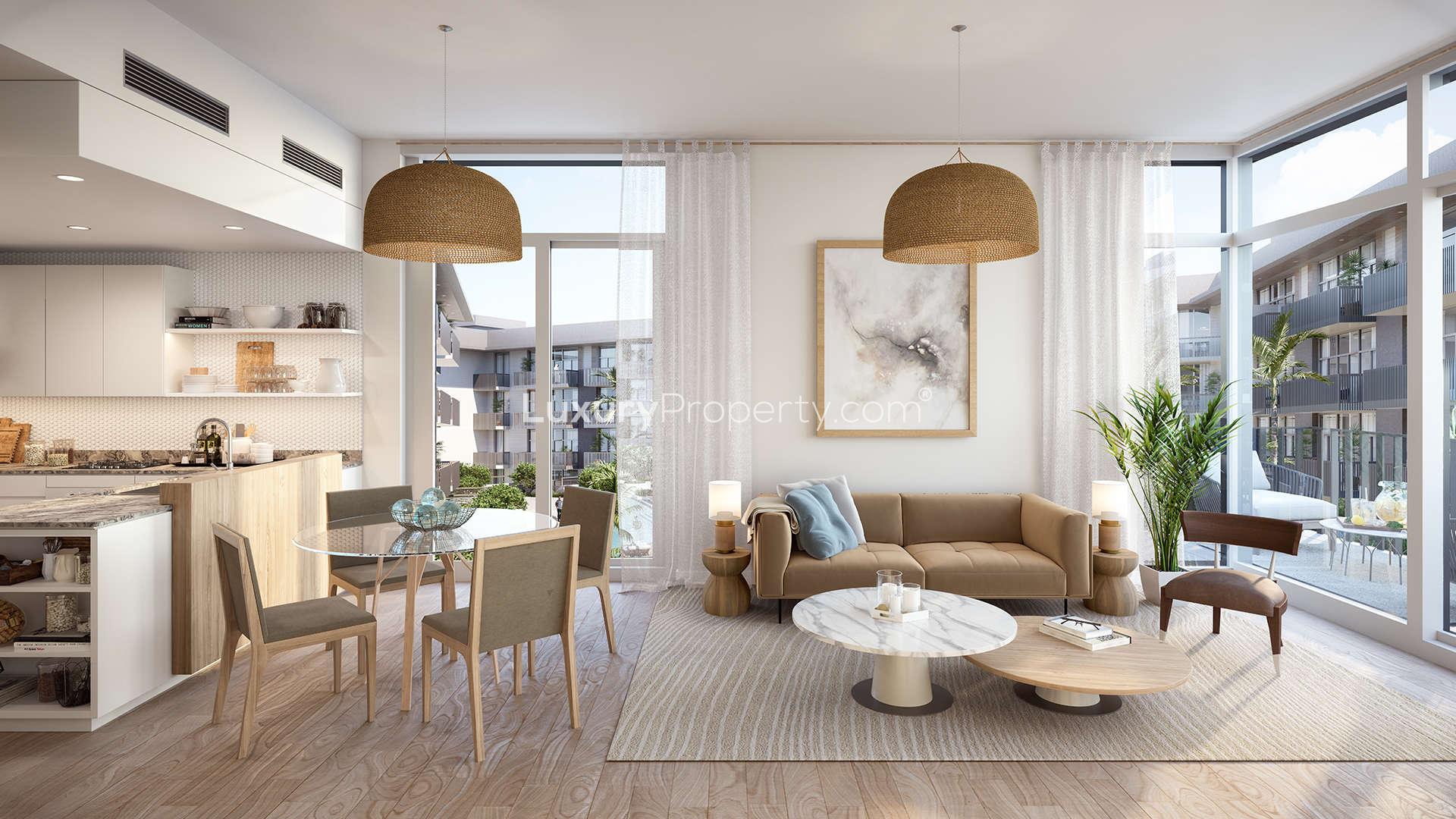 Outdoor pool and lounge area at Belgravia III, Jumeirah Village Circle apartment complex