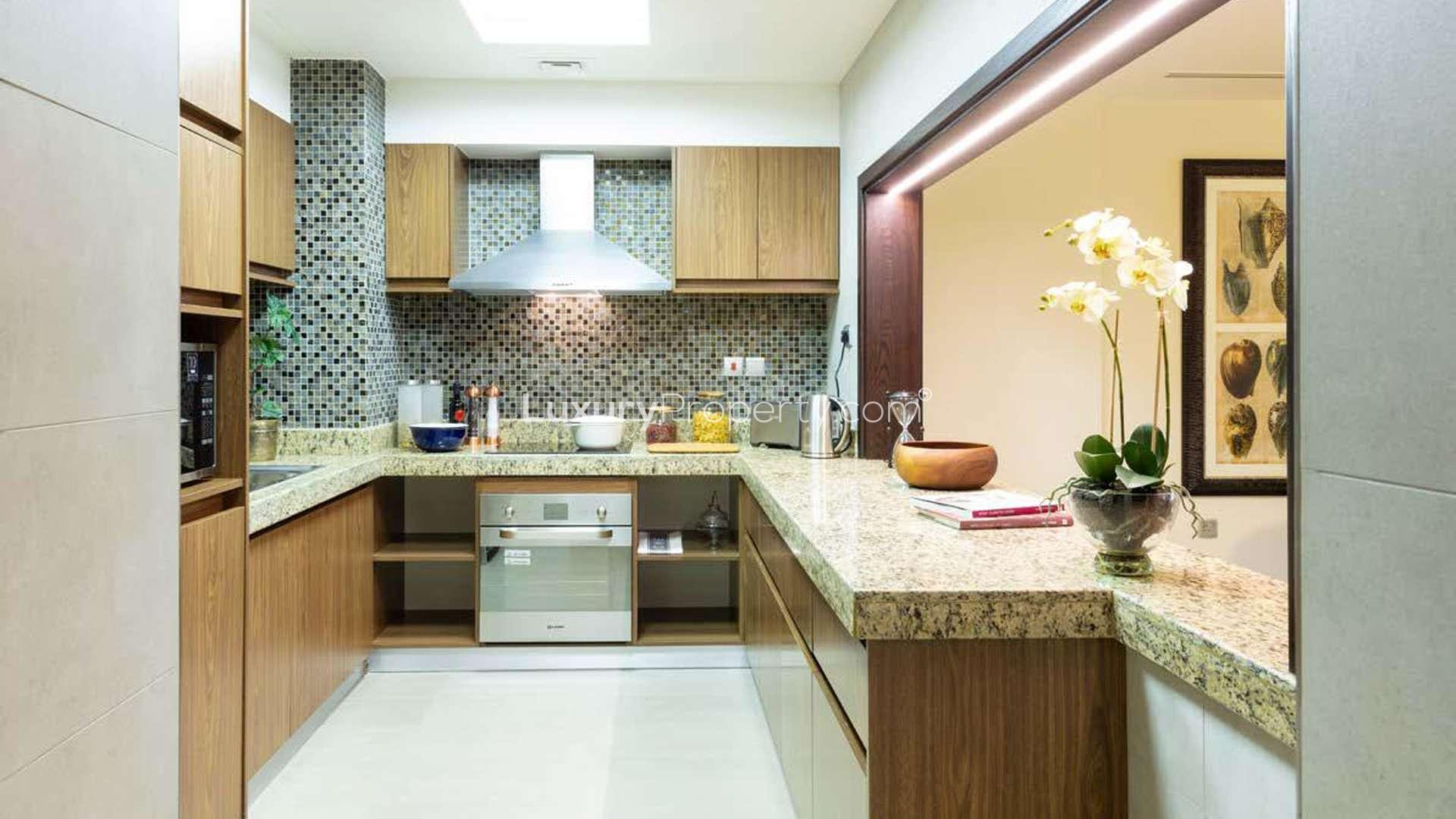 Cosy studio apartment bedroom in Dubai Wharf, Culture Village, featuring elegant decor and natural light