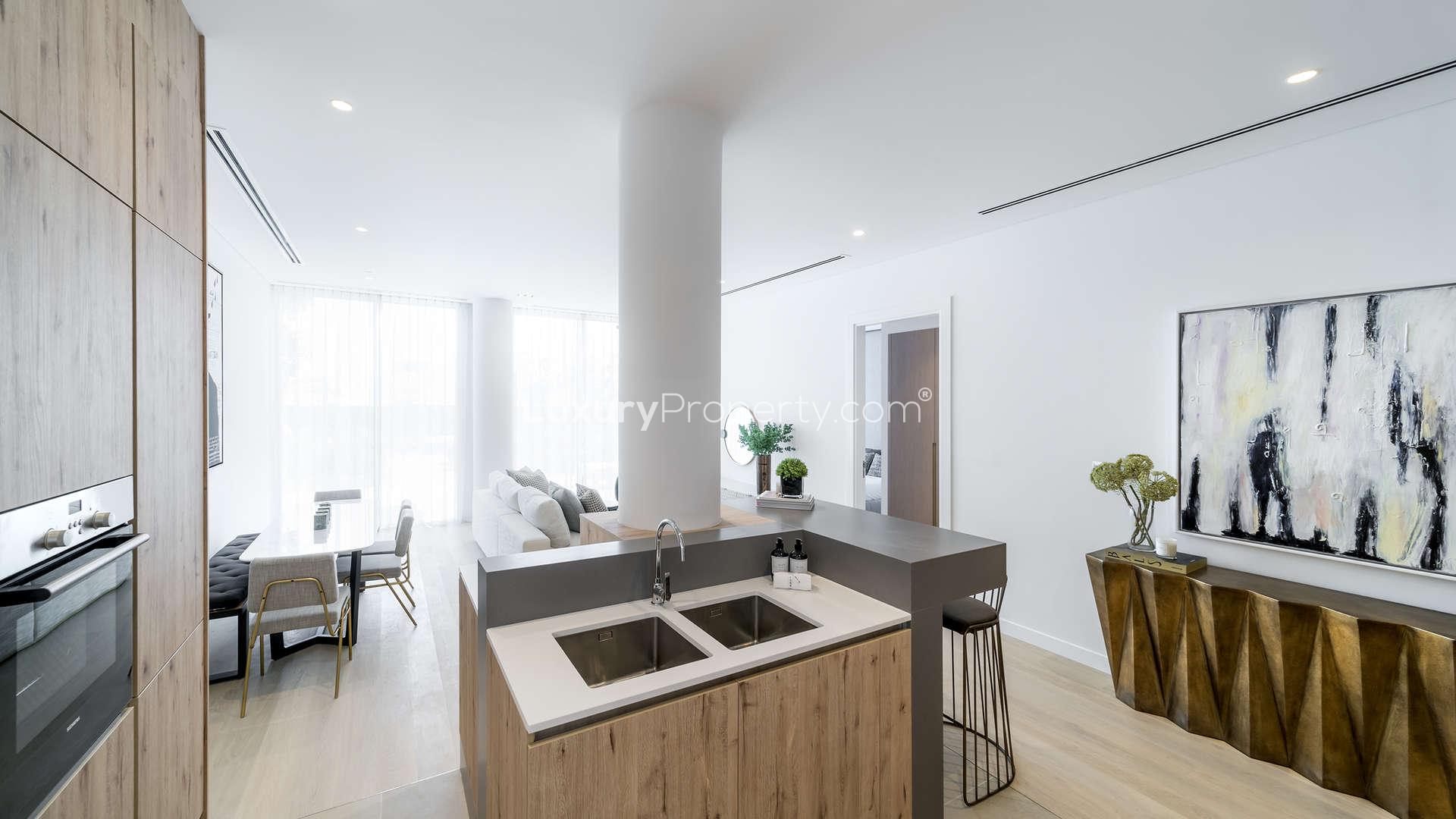 Modern studio apartment kitchen and living area in The Neighbourhood, Al Barari, Dubai