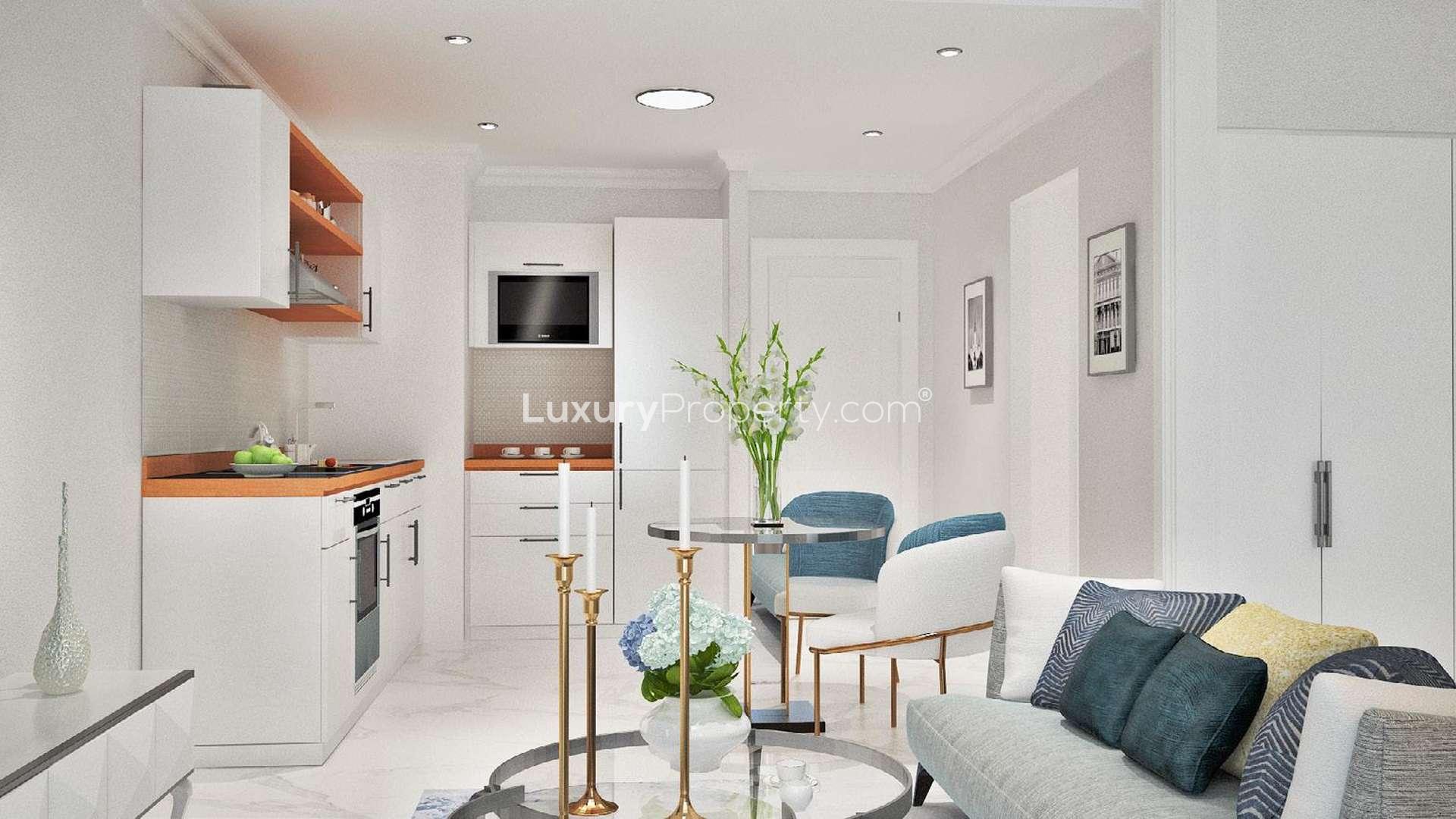 "Elegant studio apartment balcony view at Vincitore Benessere, Arjan, Dubailand, for sale.",Stylish studio apartment interior at Vincitore Benessere, Arjan, Dubailand with modern furnishings