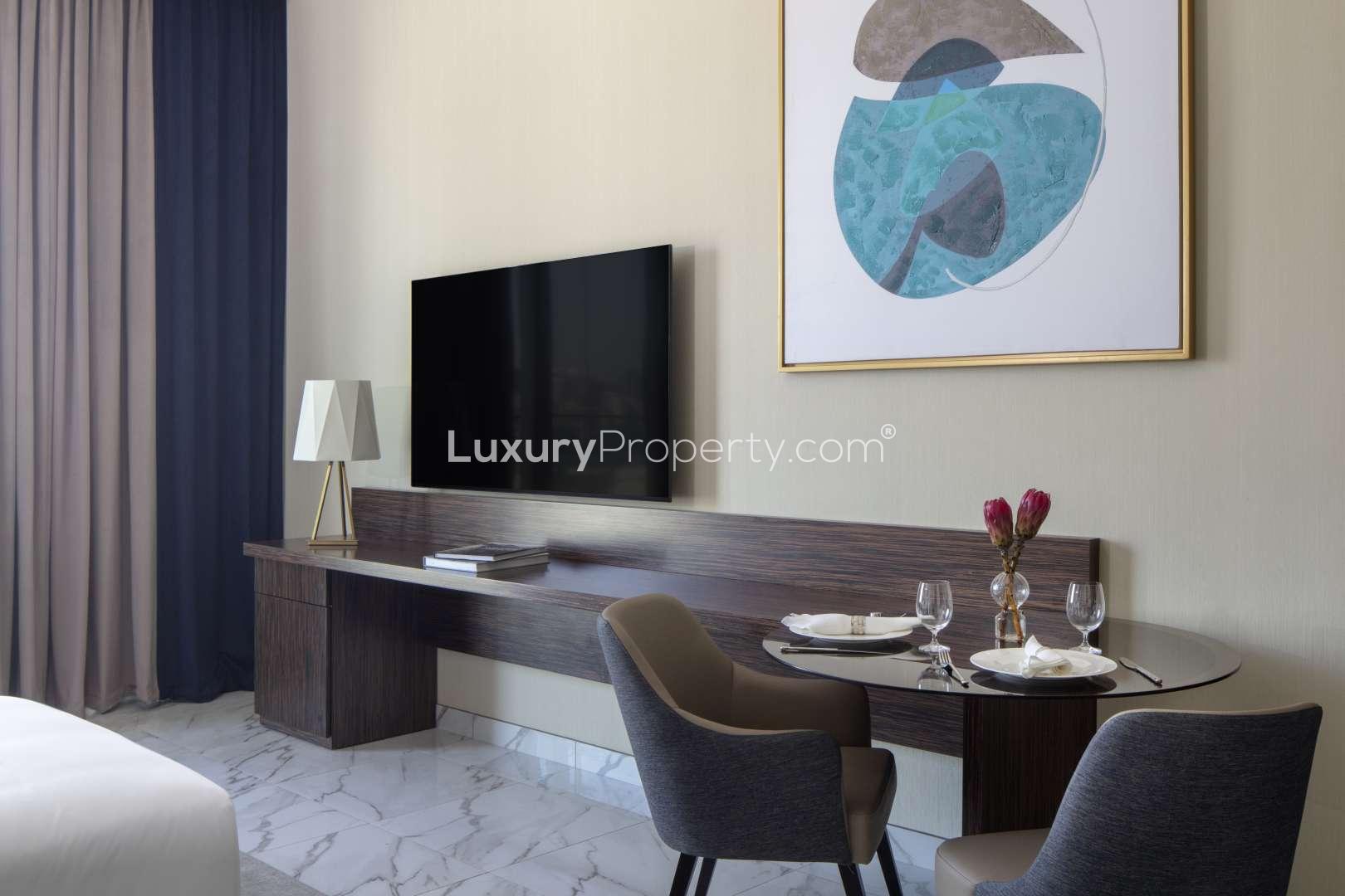 N/A,Studio apartment interior with dining area and modern decor in Avani Palm View, Dubai
