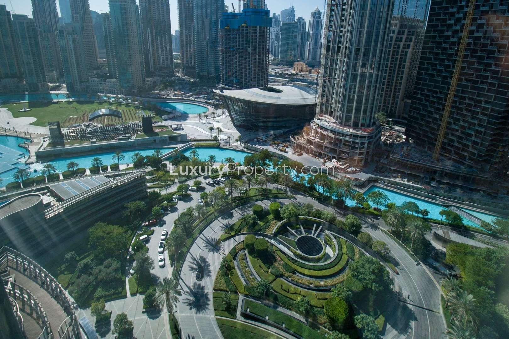 Studio apartment interior with modern furnishings, large window view, Burj Khalifa, Downtown Dubai