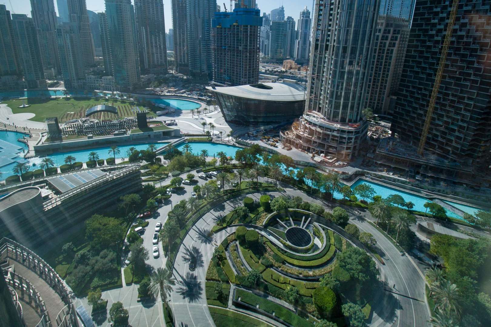 Studio apartment interior with modern furnishings, large window view, Burj Khalifa, Downtown Dubai