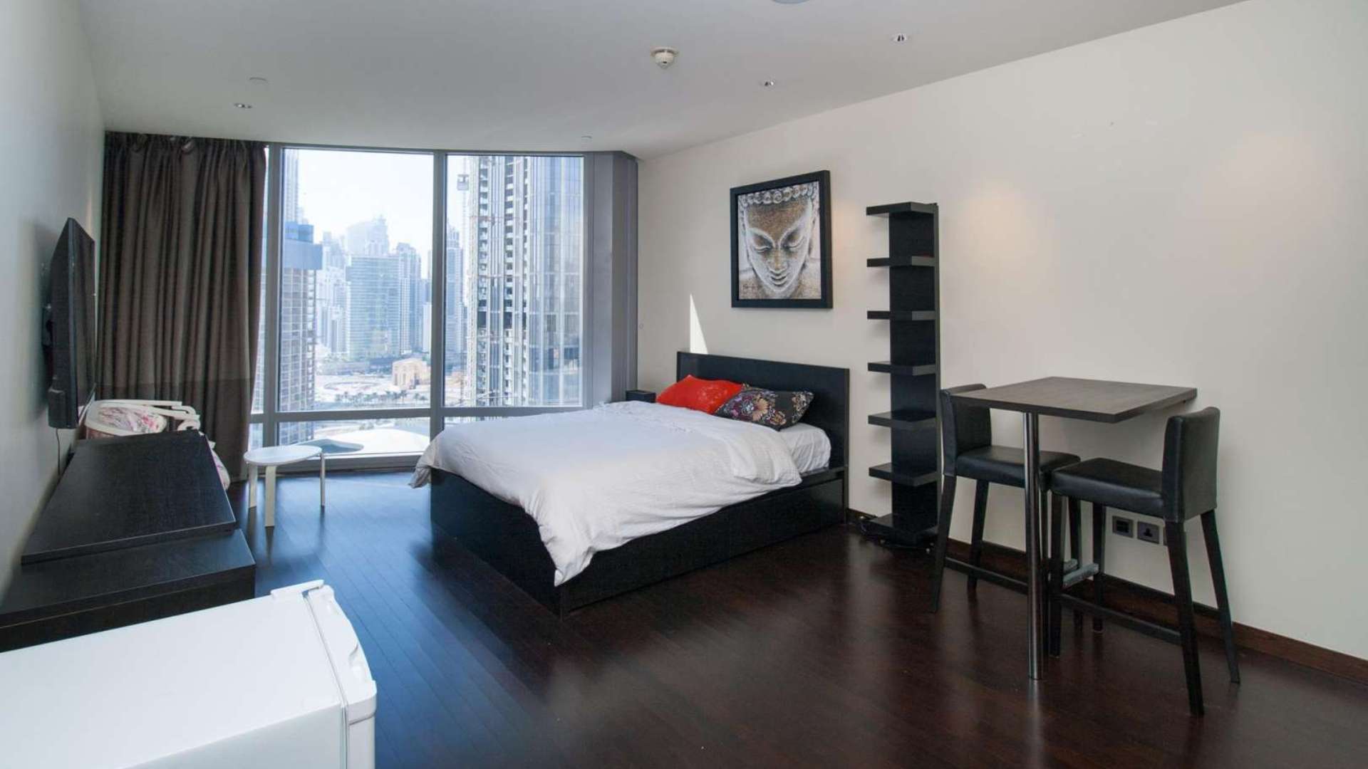 Modern bathroom in studio apartment, Burj Khalifa, Downtown Dubai, featuring glass shower and tub