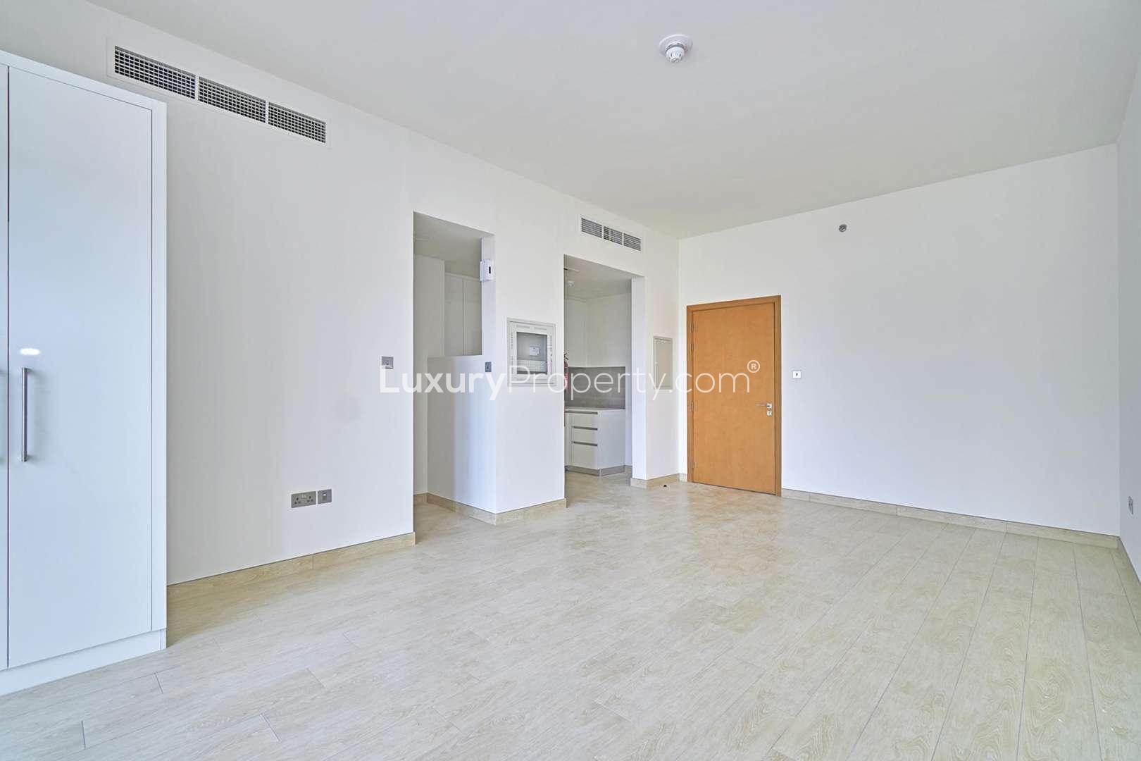 Studio apartment interior with modern kitchen in Genesis by Meraki, Al Barsha South