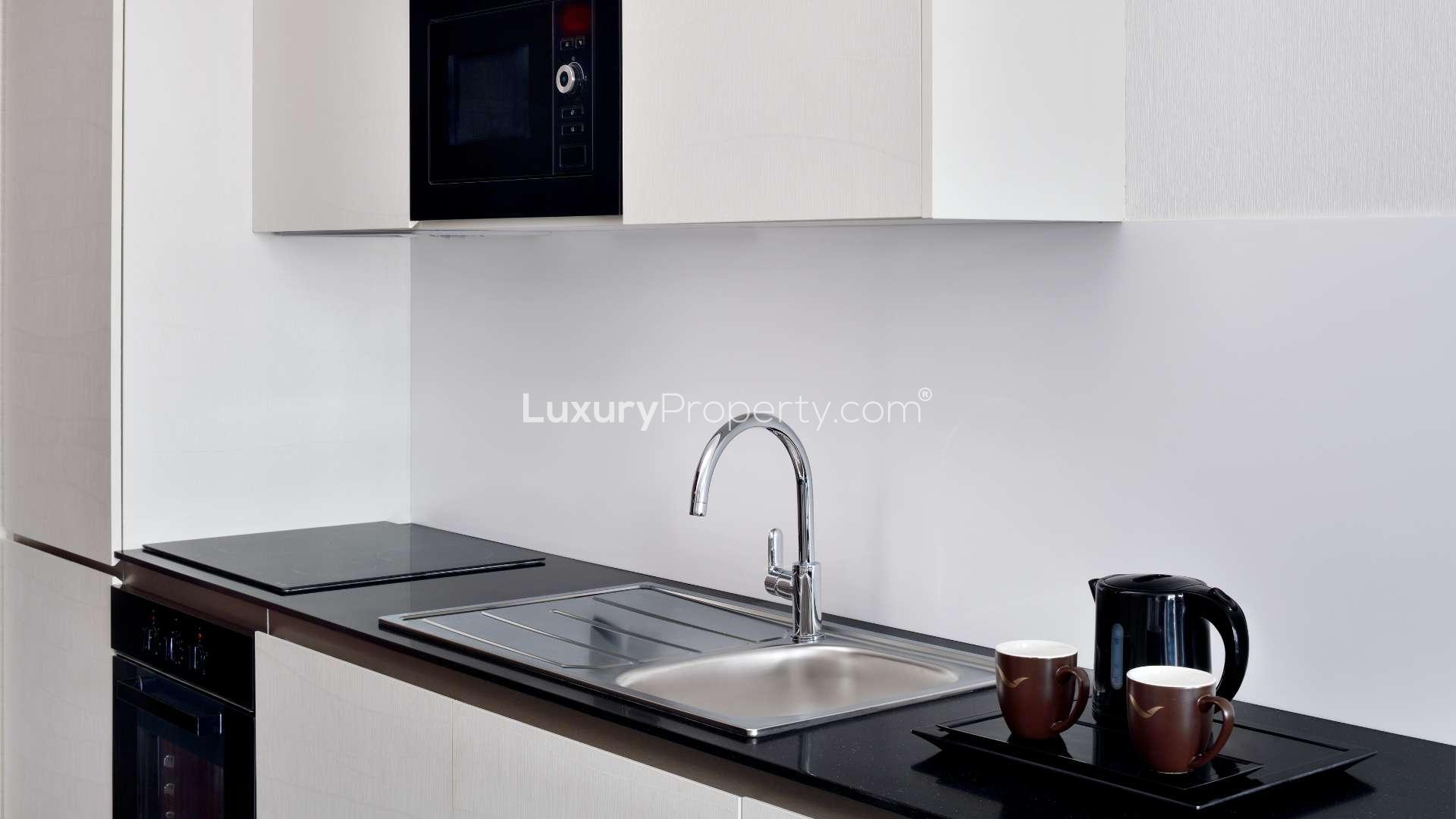 Furnished studio apartment with modern decor near Dubai Mall, available for rent