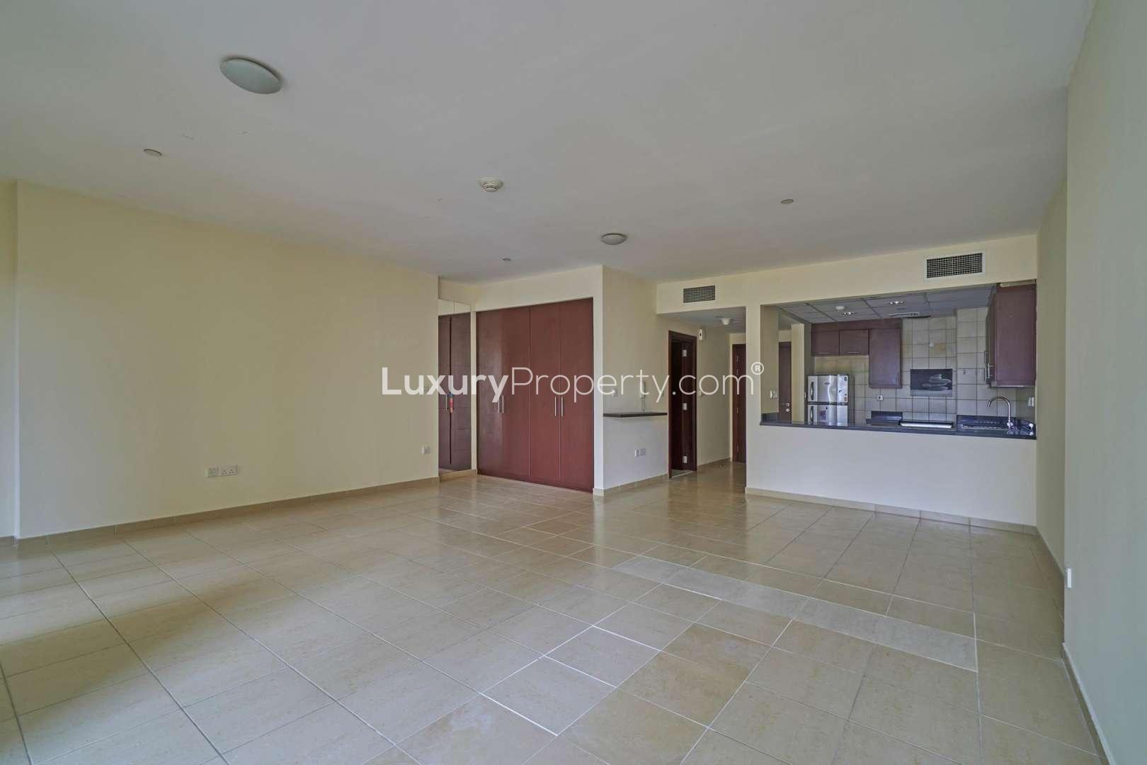 Cozy studio flat interior with tiled floors and built-in wardrobe, Jumeirah Beach Residence