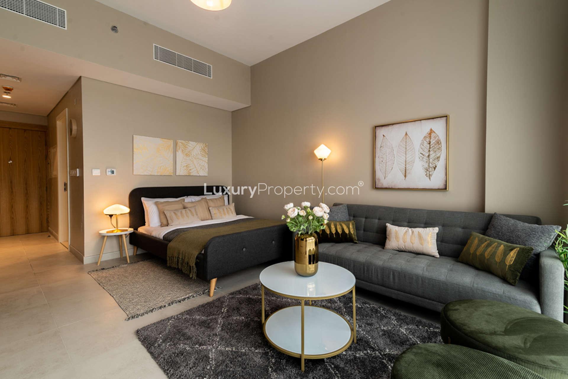 Modern kitchen in fully furnished studio apartment at Olivara Residences, Dubai Studio City