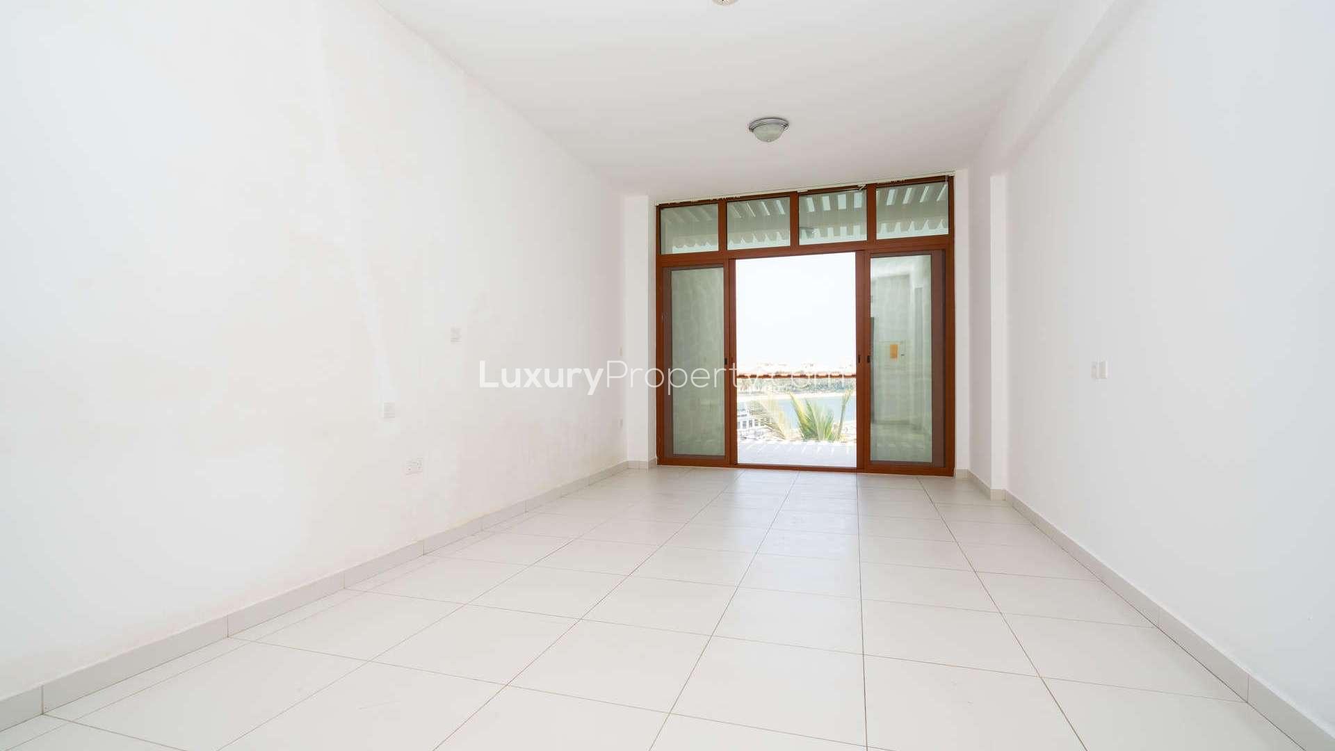 Luxurious Palm Jumeirah apartment with waterfront views, modern architecture, and marina access