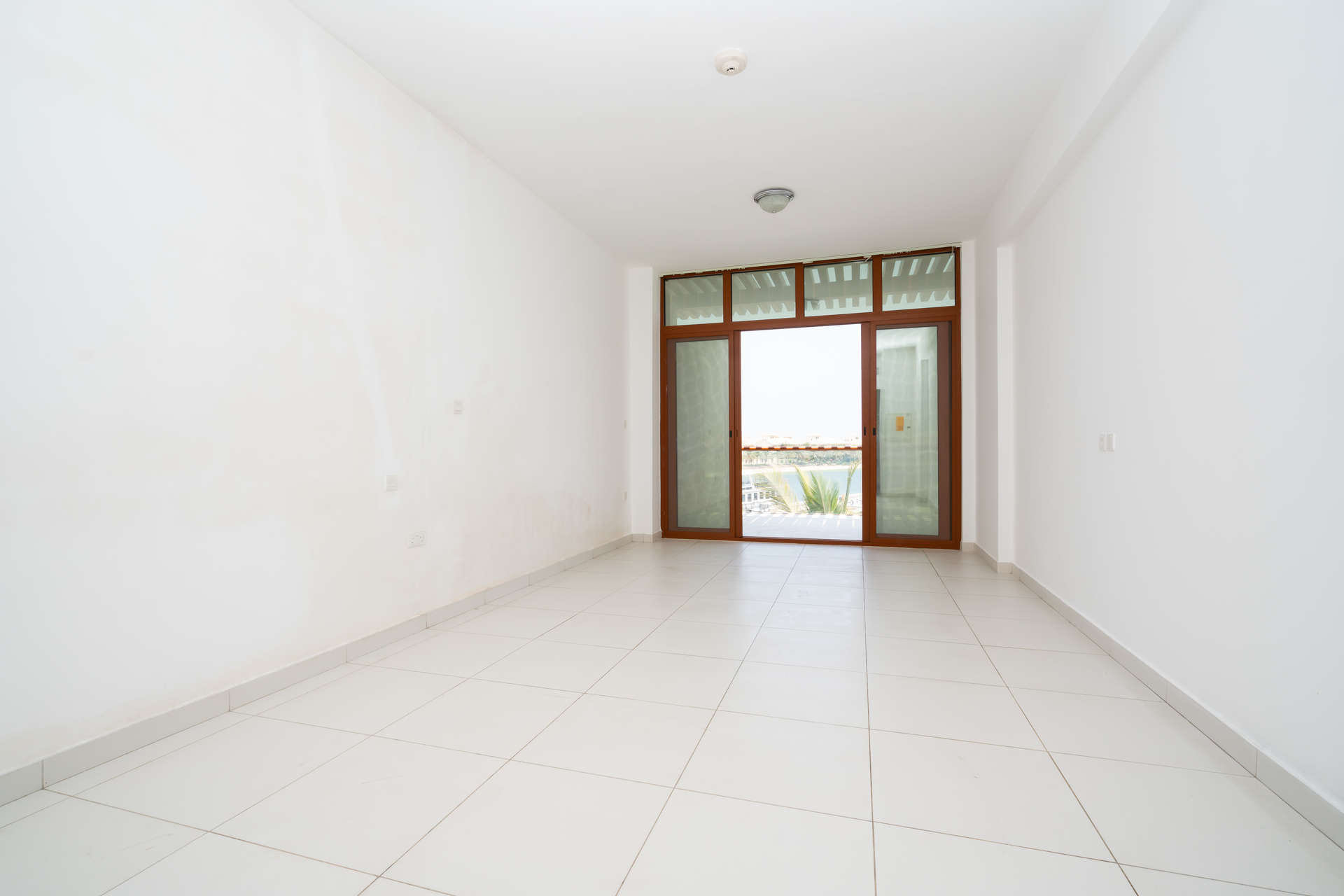 Modern kitchen in Palm Views East studio apartment, Palm Jumeirah, with colorful backsplash tiles