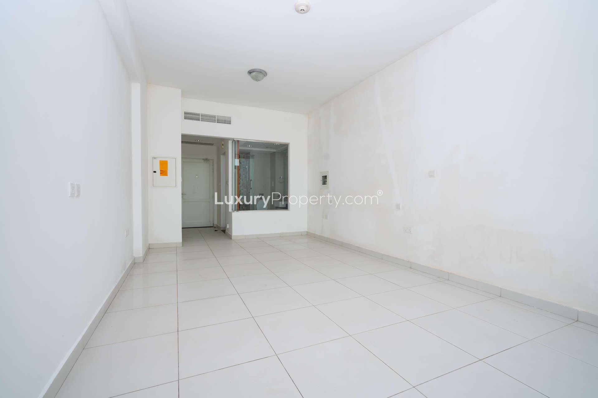 Modern kitchen in Palm Views East studio apartment, Palm Jumeirah, with sleek cabinets and backsplash