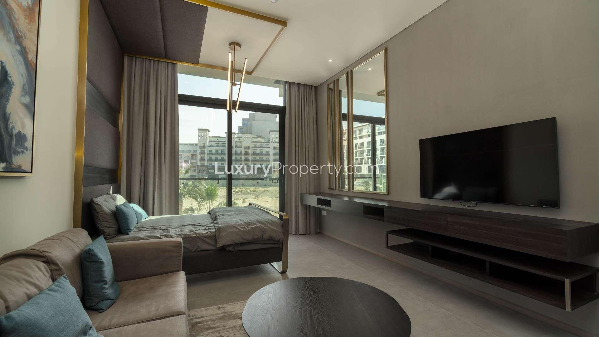 Beautiful courtyard and pool at Signature Livings, Jumeirah Village Circle apartment complex