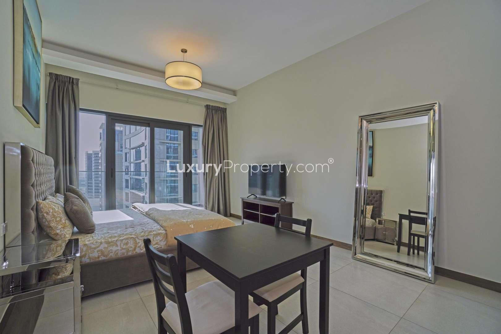 Studio apartment interior at SOL Bay, Business Bay, featuring modern furnishings and city views