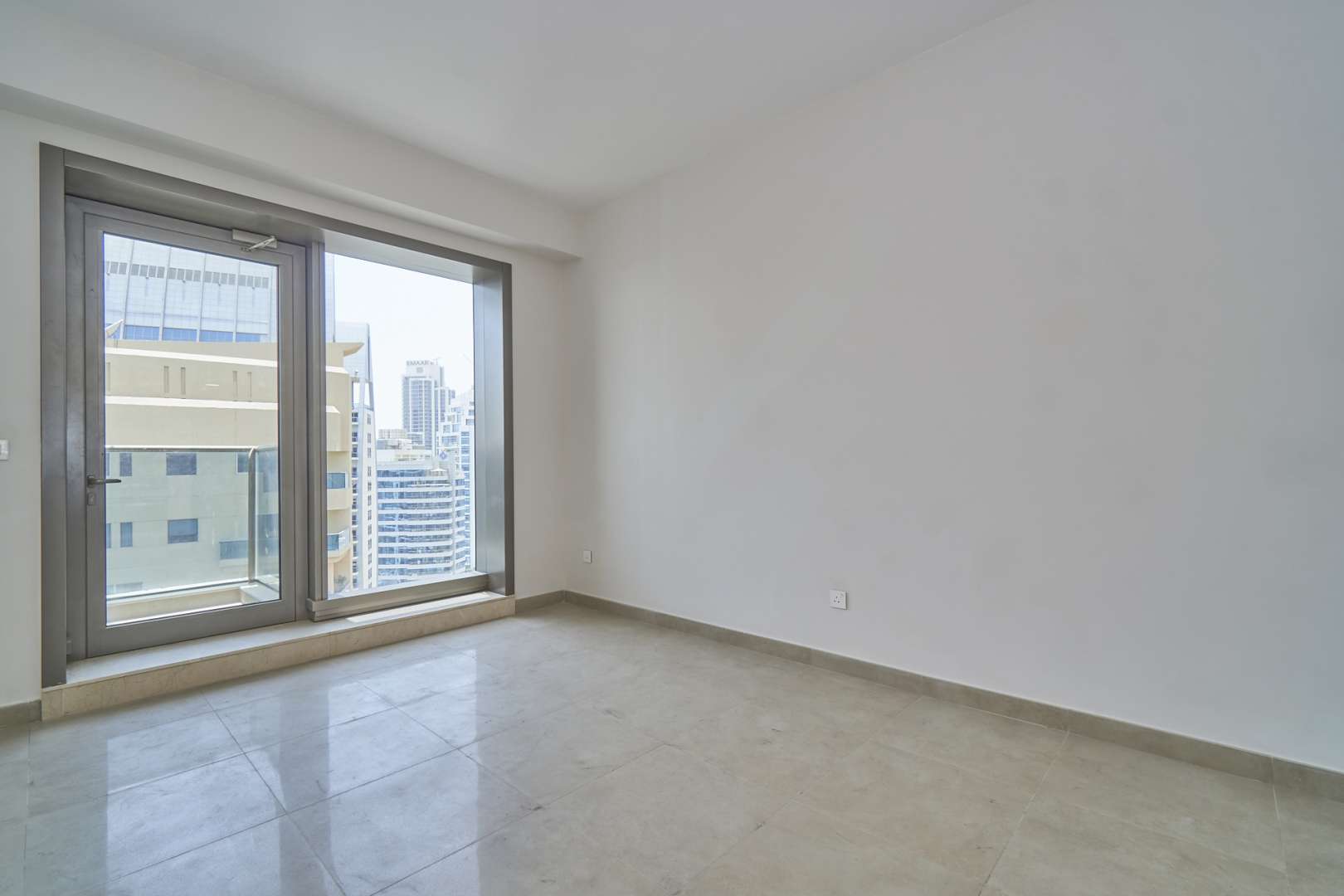 High-floor studio apartment view in Sparkle Towers, Dubai Marina with waterfront scenery