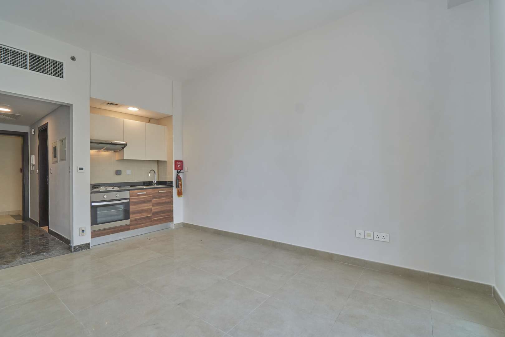 High-floor studio apartment interior with city view in Sparkle Towers, Dubai Marina