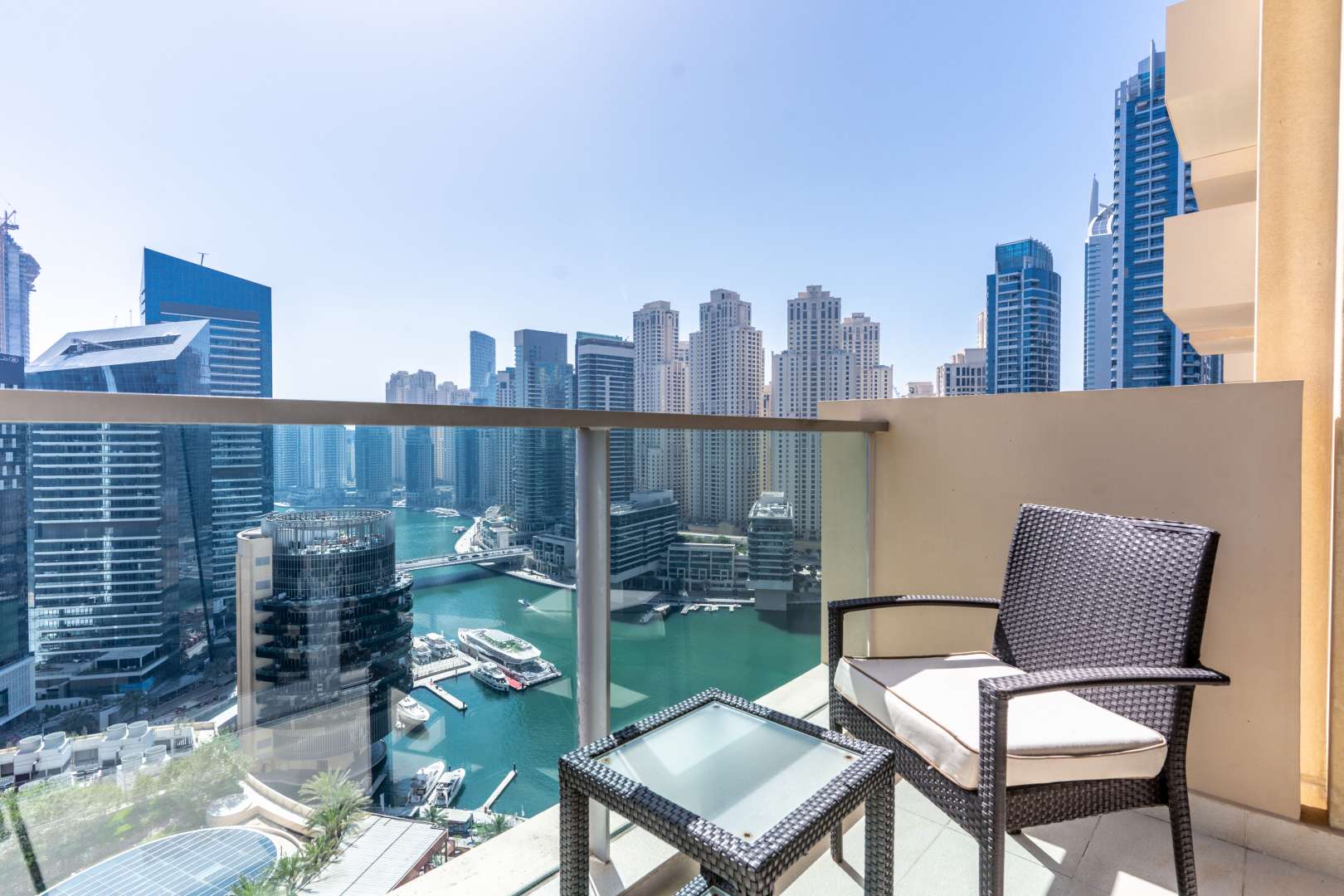 Aerial view of Dubai Marina from The Address, showcasing pool and waterfront skyline