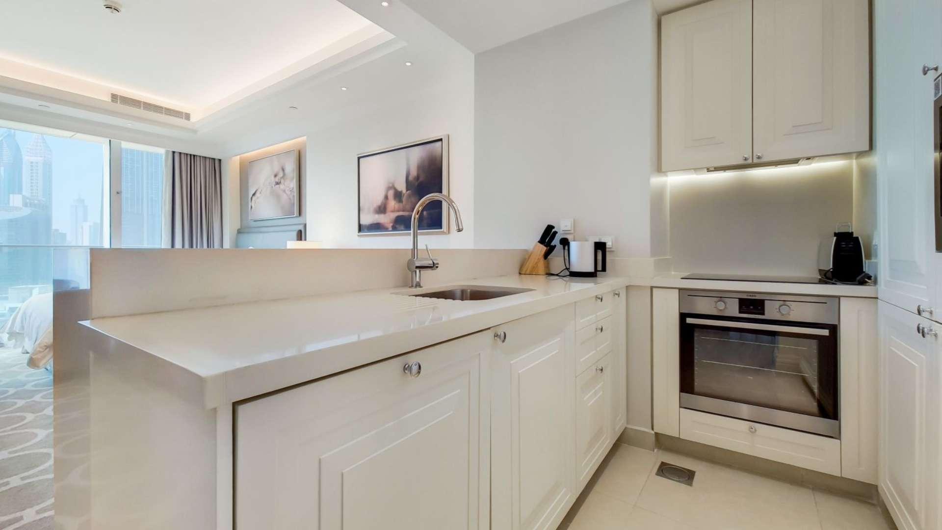 Serviced studio apartment interior with city view in Downtown Dubai, The Address The BLVD