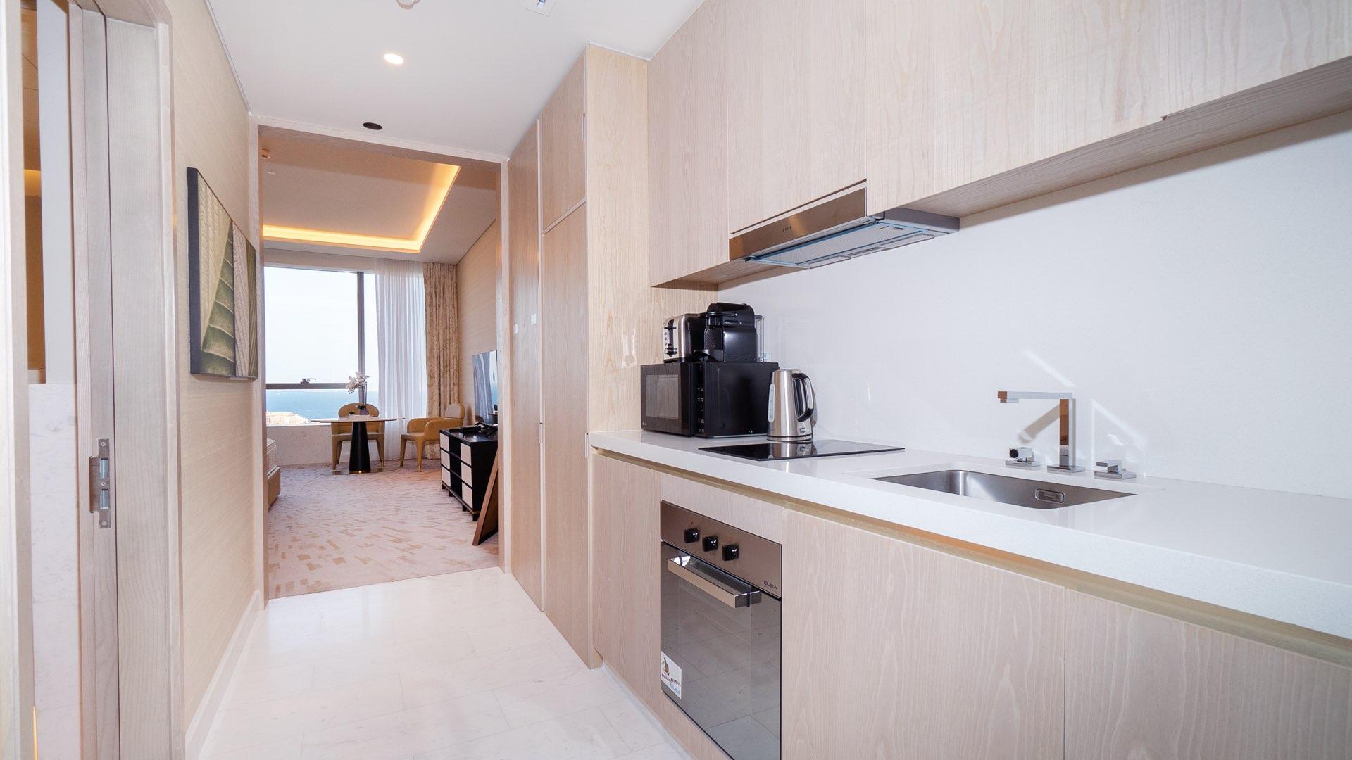 Furnished studio apartment entrance with modern decor in The Palm Tower, Palm Jumeirah