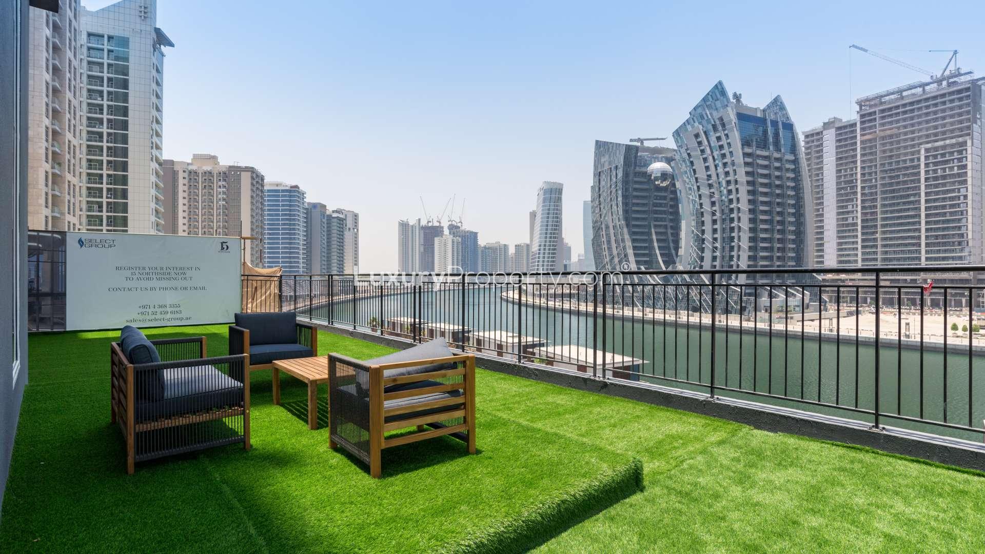Luxurious waterfront apartment view in Business Bay, showcasing skyline and canal scenery