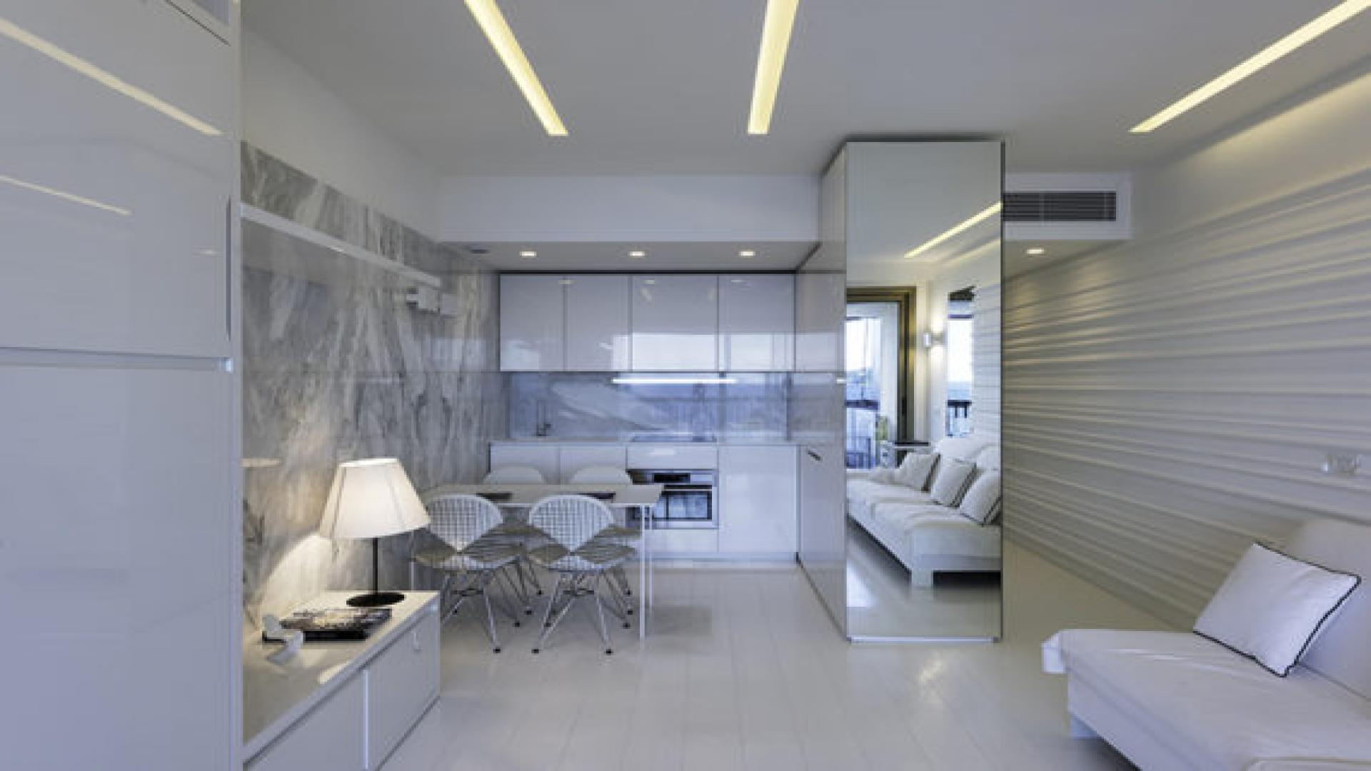 N/A,Modern studio kitchen with marble accents in Monaco Montecarlo, Mirabeau luxury apartment.