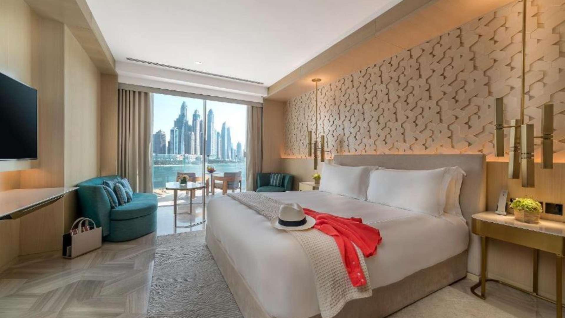 Luxurious studio apartment view, FIVE Palm Jumeirah, overlooking beach and skyline