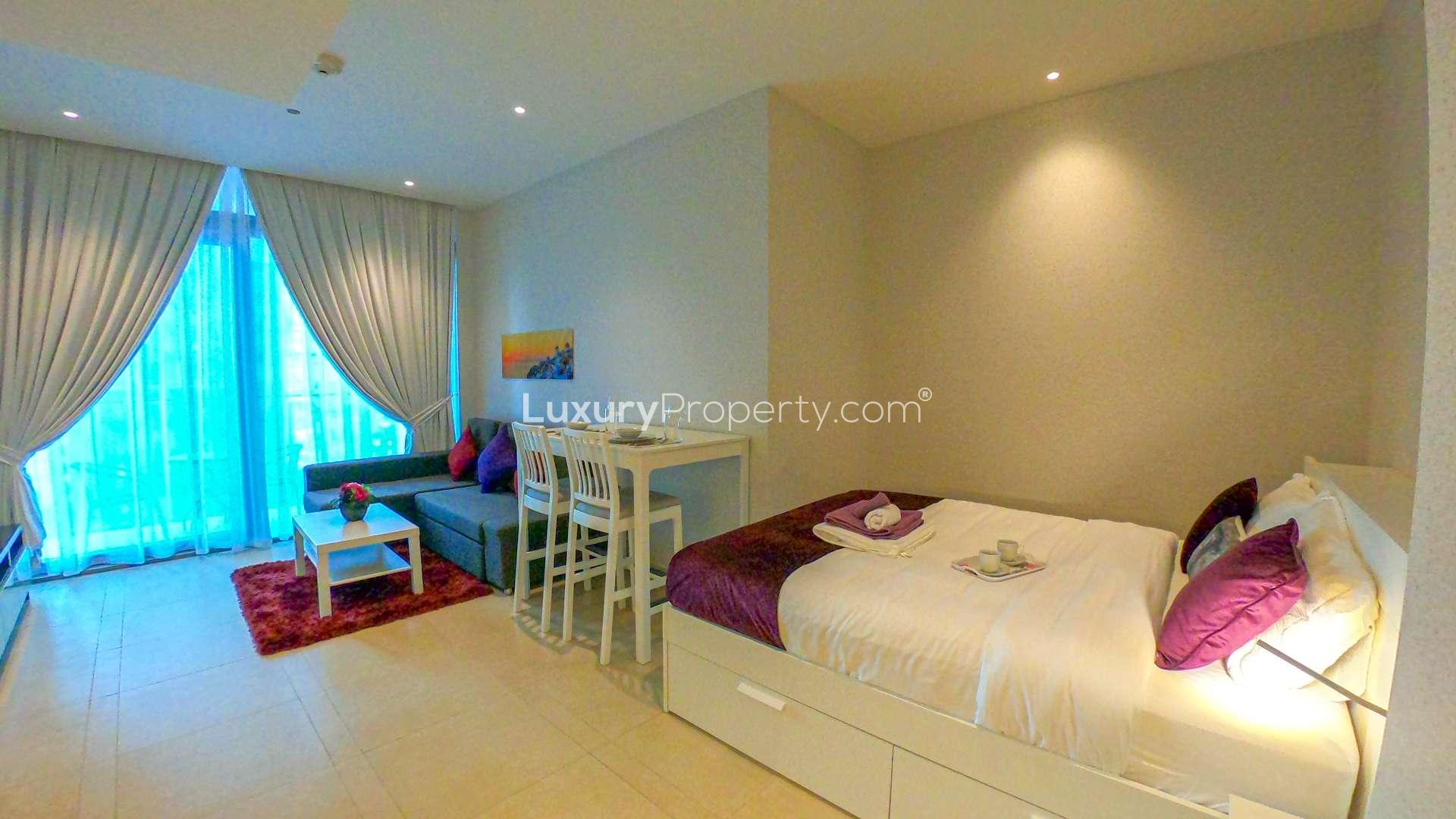 Studio apartment living room in Marina Gate 2, Dubai Marina with modern decor and balcony view