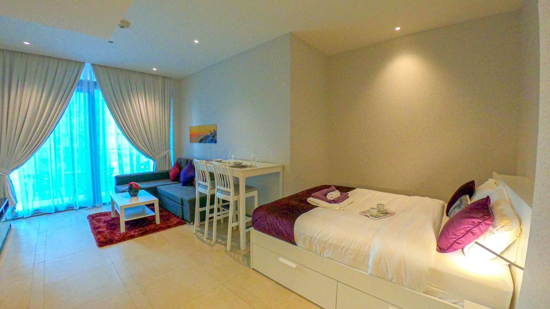 Studio apartment living room in Marina Gate 2, Dubai Marina with modern decor and balcony view