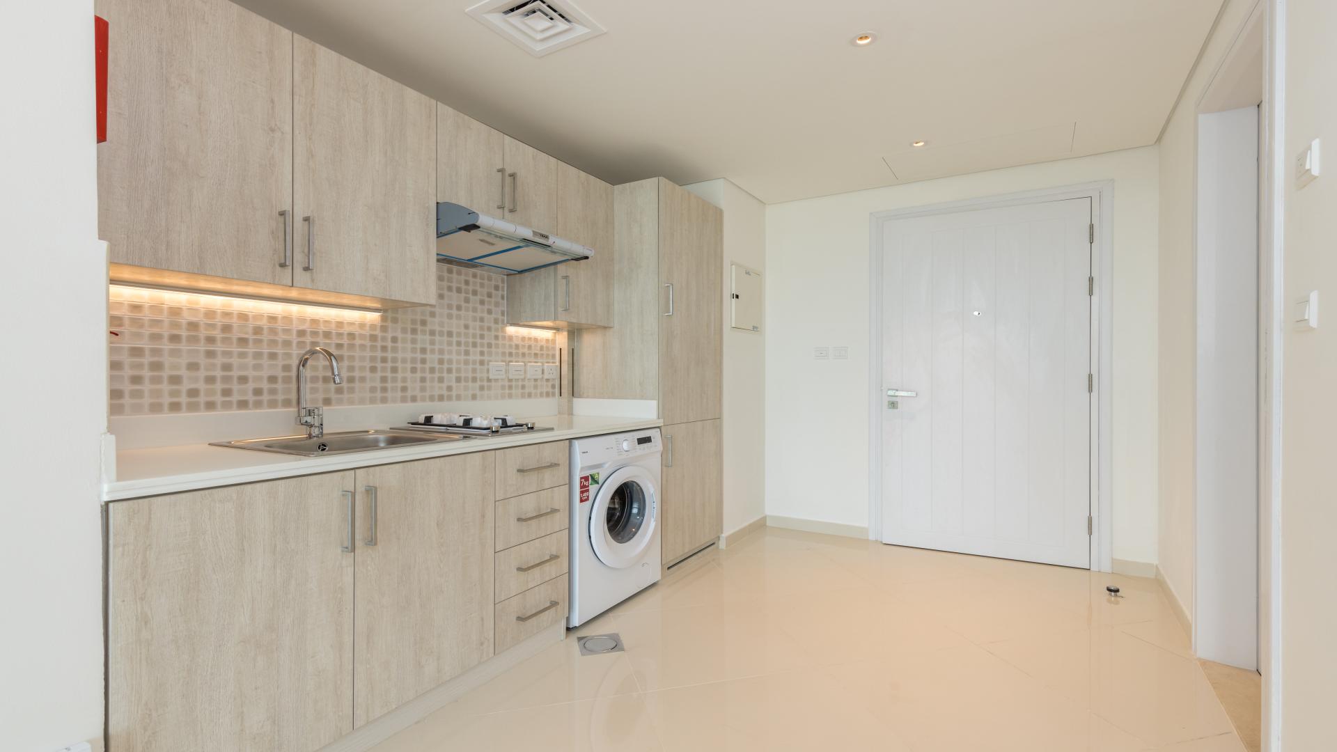 Empty modern studio apartment with large windows and sea view at Seven Palm, Palm Jumeirah